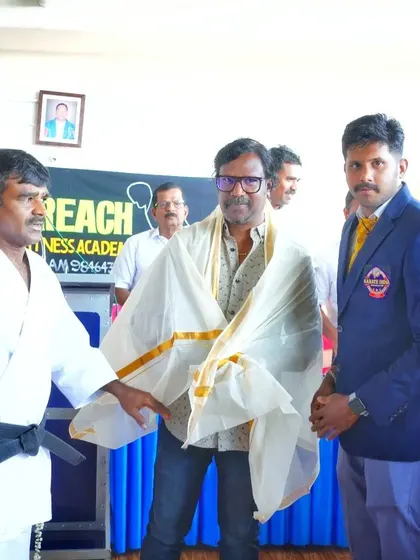 The conclusion of the felicitation, showing the mutual respect that is a core tenet of martial arts.