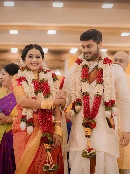 The happy couple walks hand-in-hand, surrounded by their loved ones, their journey as husband and wife begins.
