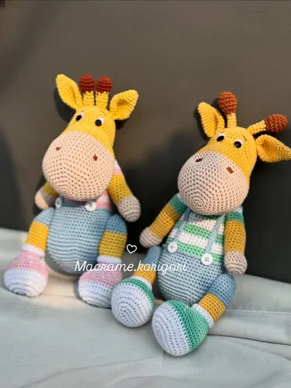 A different angle of our handmade crochet giraffes. Standing at about 11.5 inches tall, they are a substantial size for playtime and make a beautiful statement piece in a nursery.