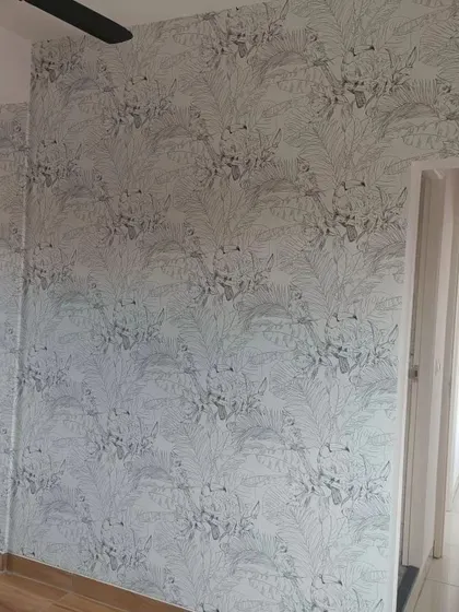 A subtle, sketch-like wallpaper with a fine-lined leaf pattern. This minimalist design adds texture and artistic flair without dominating the room.