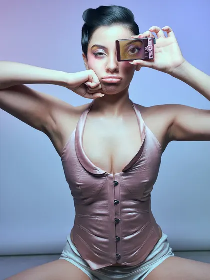 The clean version of the Utsukushii magazine shot, a Y2K-inspired portrait with a digicam prop.