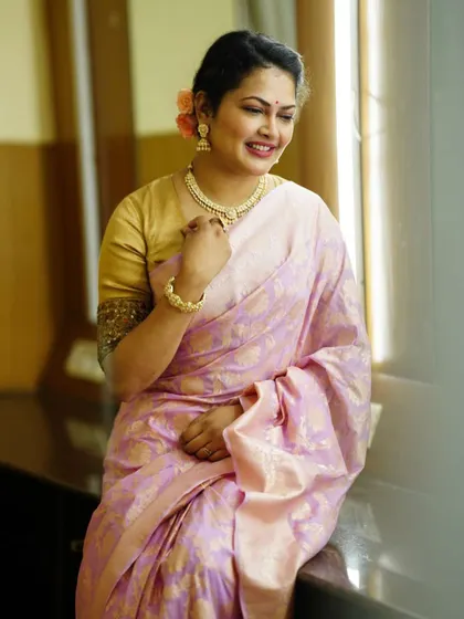 Another shot of the beautiful pink Banarasi saree, showing the intricate weaving and delicate color.