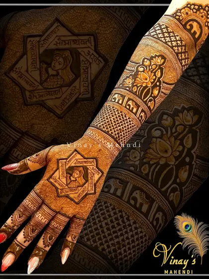 This unique back-hand design features a geometric star pattern with a mantra written inside. It's a modern take on spiritual henna.