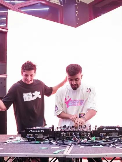 Another candid of me and a fellow DJ at the decks. The interaction and shared energy make for a better party.