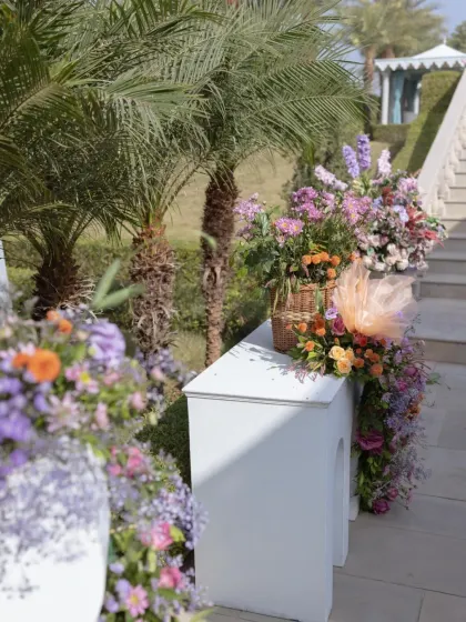 A close-up of the floral arrangements lining the staircase, showing the beautiful mix of colors and textures.
