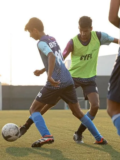 A low-angle shot capturing the intensity of a training match. We create a competitive environment where players can sharpen their skills under pressure.