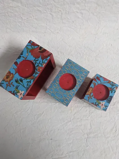 A top-down view of the floral candle holders, showing the space for the tea-lights.