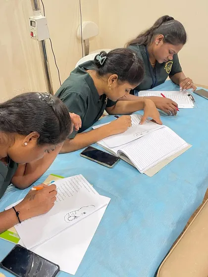 This image captures the dedication of the clinic staff as they work on improving their professional skills. My training aims to build confidence that translates directly to their work.