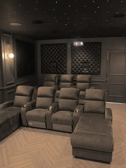 A duplicate of 210, this wide shot provides a comprehensive look at the finished project, from the seating to the screen and the acoustic treatments.