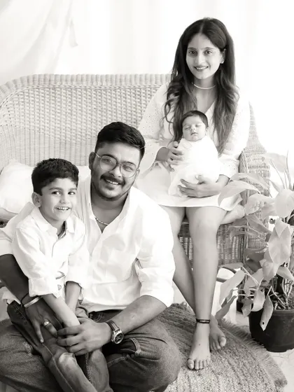 A full family portrait in black and white, creating a classic and formal keepsake that will never go out of style.