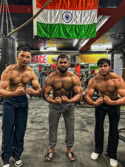 Front double bicep pose with the crew. We stand together, strong and united. This is the power of a supportive community.