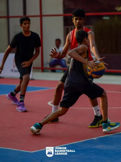 A player on defense, staying low and ready. My youth leagues emphasize all aspects of the game, including strong defensive principles.