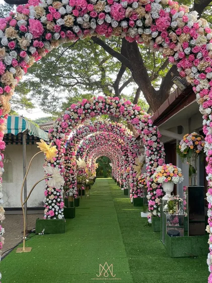 Another view of the stunning floral tunnel, showcasing the sheer volume of flowers used to create this immersive and romantic walkway.