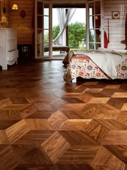 A second look at the stunning geometric wood flooring. This design proves that your floor can be the most artistic element in the room, creating a dynamic and luxurious foundation.