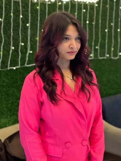 A student's work on creating a modern, chic look with a rich color and soft waves. This style is perfect for a party or special occasion, and I ensure my students can deliver it with confidence.