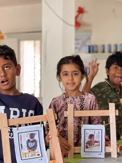 Silly faces and serious accomplishments! These kids are having a blast showing off the photo frames they built from scratch.