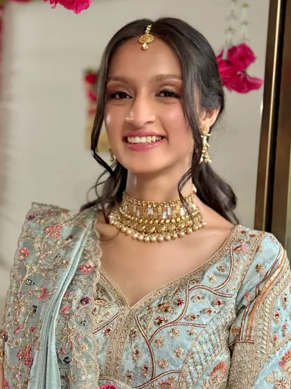 A bright and happy portrait of the bride, looking excited for her wedding festivities.