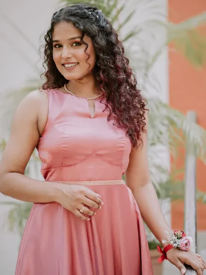 This bridesmaid's natural curls were styled beautifully to complement her soft and romantic makeup look.