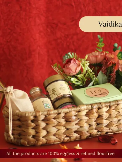 The Vaidika 1.0 hamper is a charming and rustic choice. This handcrafted basket contains a selection of our traditional treats, including mukhwas and a mini loaf cake, all 100% eggless.