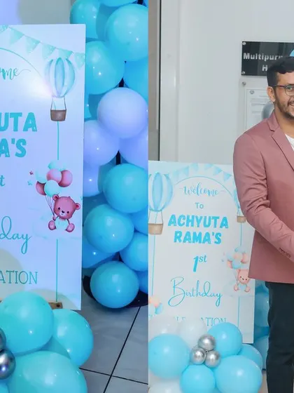 A whimsical unicorn-themed birthday party, complete with a pastel rainbow balloon arch, a shimmering backdrop, and a custom unicorn cake, creating a magical setting for a little girl's dream celebration.
