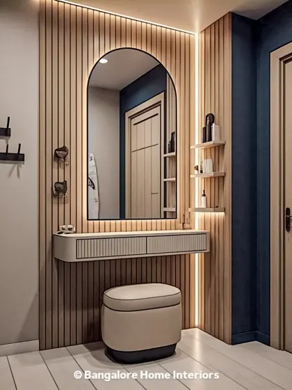 This chic dressing unit features a floating vanity with reeded drawer fronts and an arched mirror. The vertical wood paneling and integrated backlighting create a warm and stylish corner.