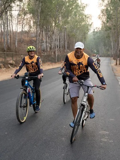 A couple enjoys a scenic ride together during the Tour de Forest, making fitness a shared activity.