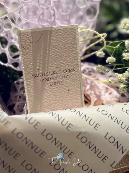 The smallest details carry the biggest meaning. A custom note reading "Smells like success (and vanilla peony)" adds a touch of personality and wit to a brand launch gift, showing how I infuse every element with the client's unique story.