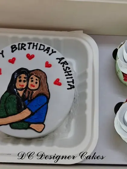 I can turn any idea into a sweet treat, like this custom hand-painted bento cake. This set, made for a birthday, includes a personalized portrait on the mini cake and two matching floral cupcakes.