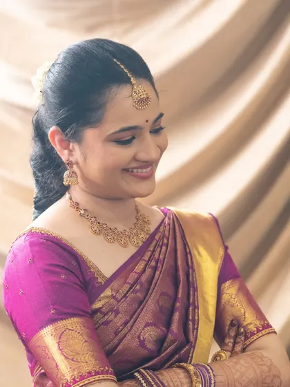 A lovely, smiling portrait of Vibha for her engagement. The makeup is minimal and clean, with a focus on enhancing her naturally beautiful features.