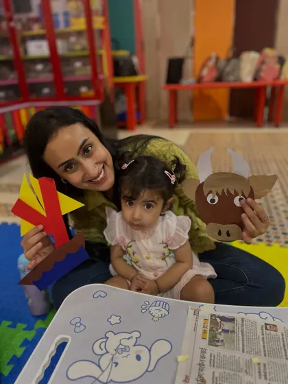 A proud mother and daughter duo at our Rajouri Garden center pose with the crafts they made together.