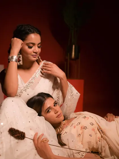 A series of images from a creative and art direction project for Ruhm India. We used a bold red backdrop to contrast with the elegant white chanderi and mirror-work outfits, creating a visually striking and artistic campaign.