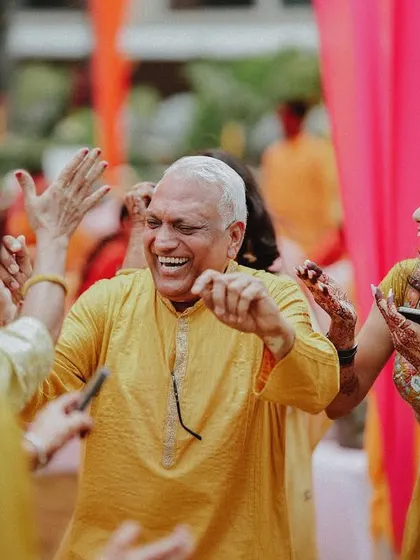 A duplicate of the joyful family member dancing, capturing the happiness of the celebration.