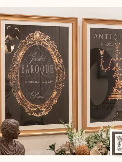 These "Le Jardin Baroque" and "Antique" wall art pieces are displayed here with other classical elements like a bust and a clam shell planter, creating a curated, museum-like feel on a wooden cabinet.