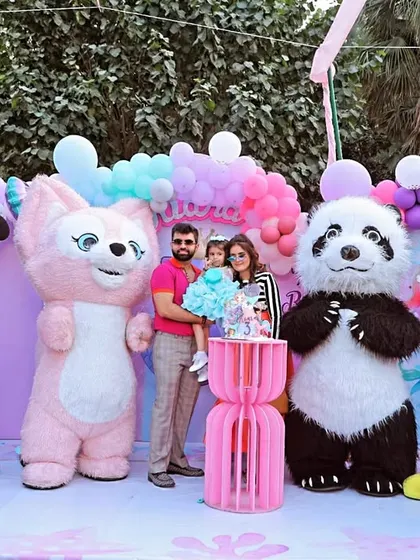 A fun-filled 3rd birthday party with character mascots. I love capturing the excitement on a child's face when they meet their heroes, surrounded by family and colorful decorations.