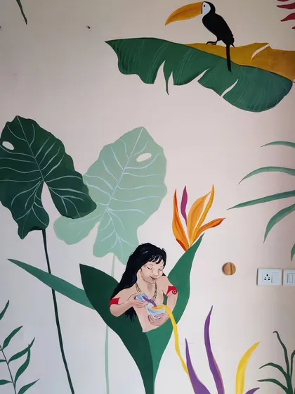 A duplicate image of the toucan and character scene.