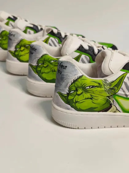 A lineup of the 'Jedi' side of the mismatched pair, featuring detailed portraits of Yoda. Each pair was meticulously hand-painted to be a true collector's item for Star Wars fans.