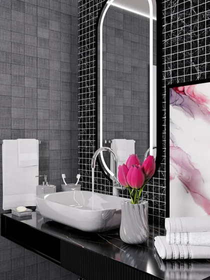 A close-up of the vanity area, highlighting the vessel sink, modern faucet, and an elegantly backlit arched mirror.