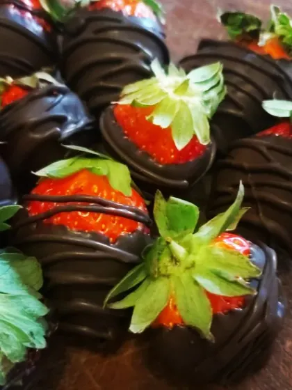 A classic romantic treat of fresh, juicy strawberries dipped in rich dark chocolate, an essential part of any Valentine's Day celebration.