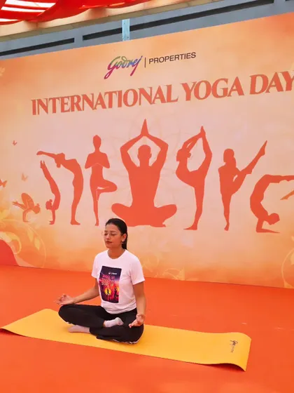 Finding a moment of peace and stillness on stage at the International Yoga Day event for Godrej Properties. Leading by example is a core part of my teaching philosophy.