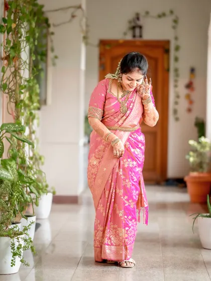 A candid shot of the bride, capturing a moment of shy laughter and happiness.