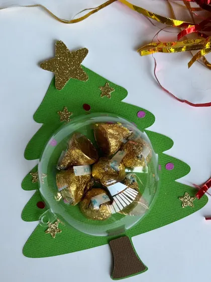 A Christmas tree shaped bauble holder, another one of our fun, handmade holiday packaging options.