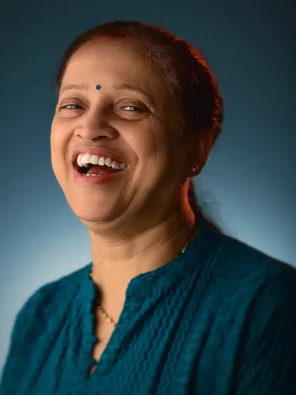 A portrait of my mom, capturing her genuine, happy laugh. My approach works for everyone, focusing on bringing out the best and most authentic version of a person.
