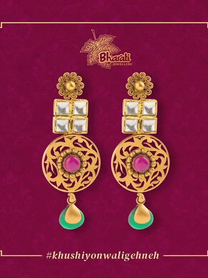 Add a touch of elegance to your look with these long, dangling earrings. The design combines traditional Kundan and intricate Jali work with colorful Meenakari drops for a vibrant, minimalist statement.