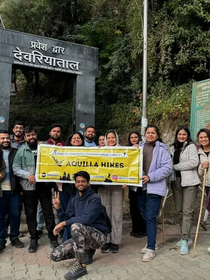 Our happy group posing with the Aquilla Hikes banner at the start of the Deoriatal trek.