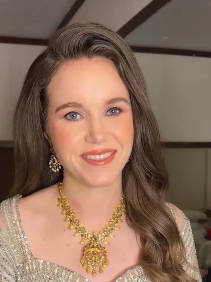 A final shot of Sarah's reception look. She looks confident and beautiful, ready to enjoy her special night.