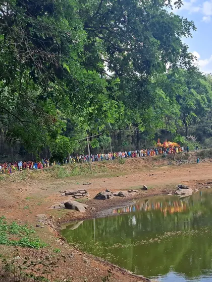 The procession or 'meravanige' of the Soliga tribe making its way past a lake. It was a beautiful sight.