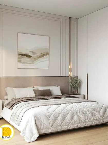 Another angle of the bedroom with classic wall moulding, showing the wardrobe with its long, elegant handles.