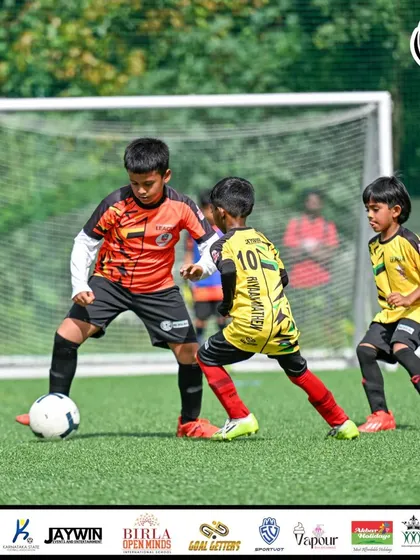 A young attacker looks to get past a defender. These one-on-one situations are crucial moments in any match.