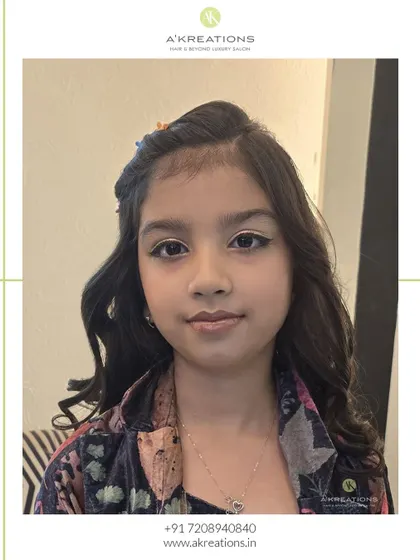 A close-up of her age-appropriate makeup, featuring a simple winged liner and a neutral lip color for a polished look.