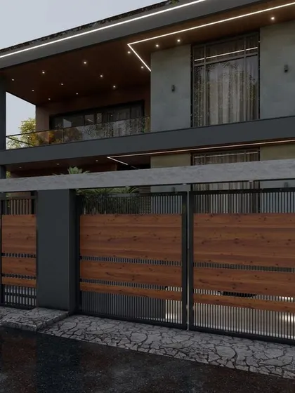 This design features a striking gate made of wood panels and metal, leading to a modern home. The upper floor has a large, covered balcony, perfect for enjoying the outdoors in any weather.